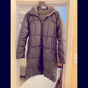 Women’s long black winter dress puffer coat.